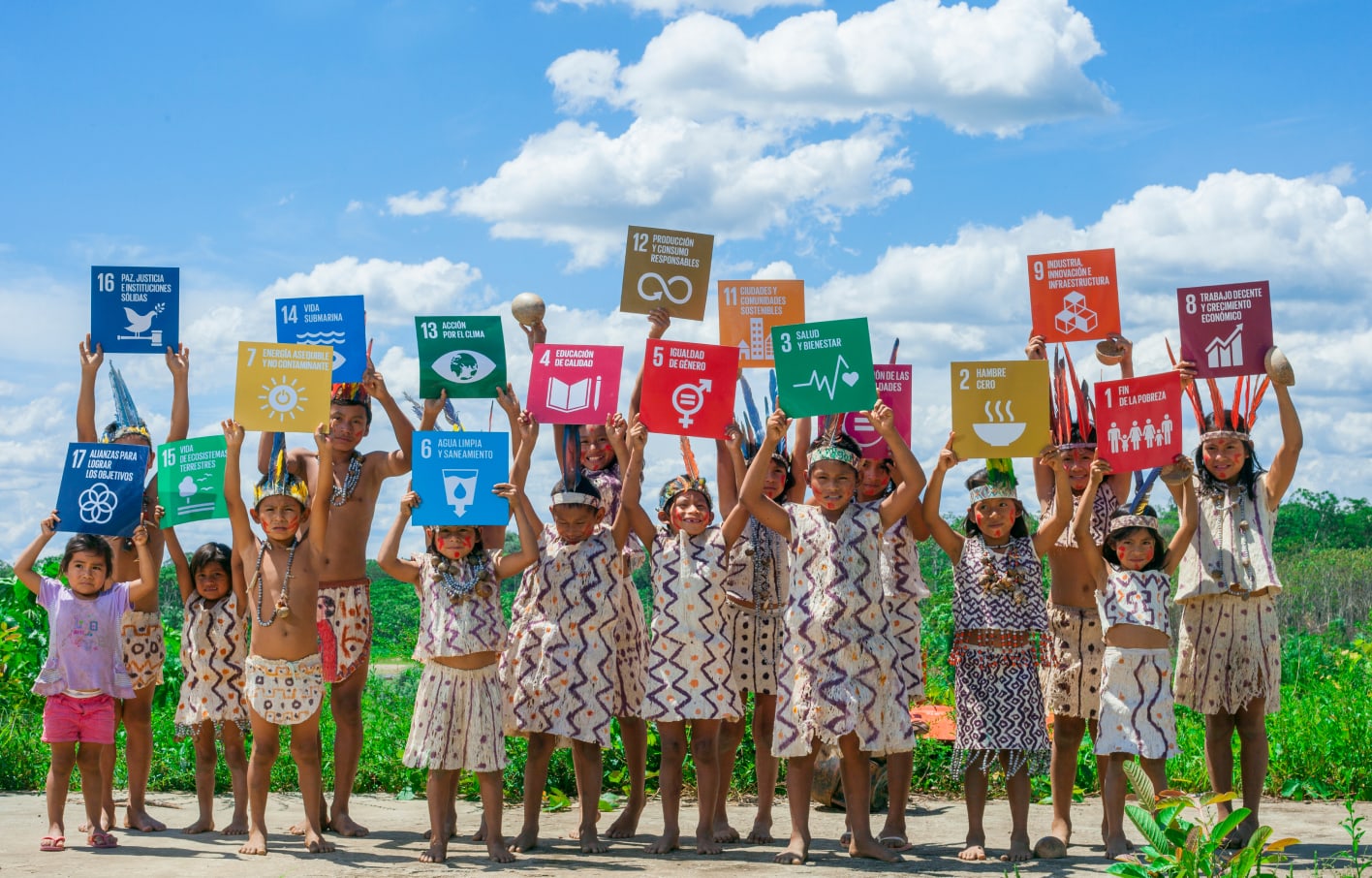 children holding SDG signs